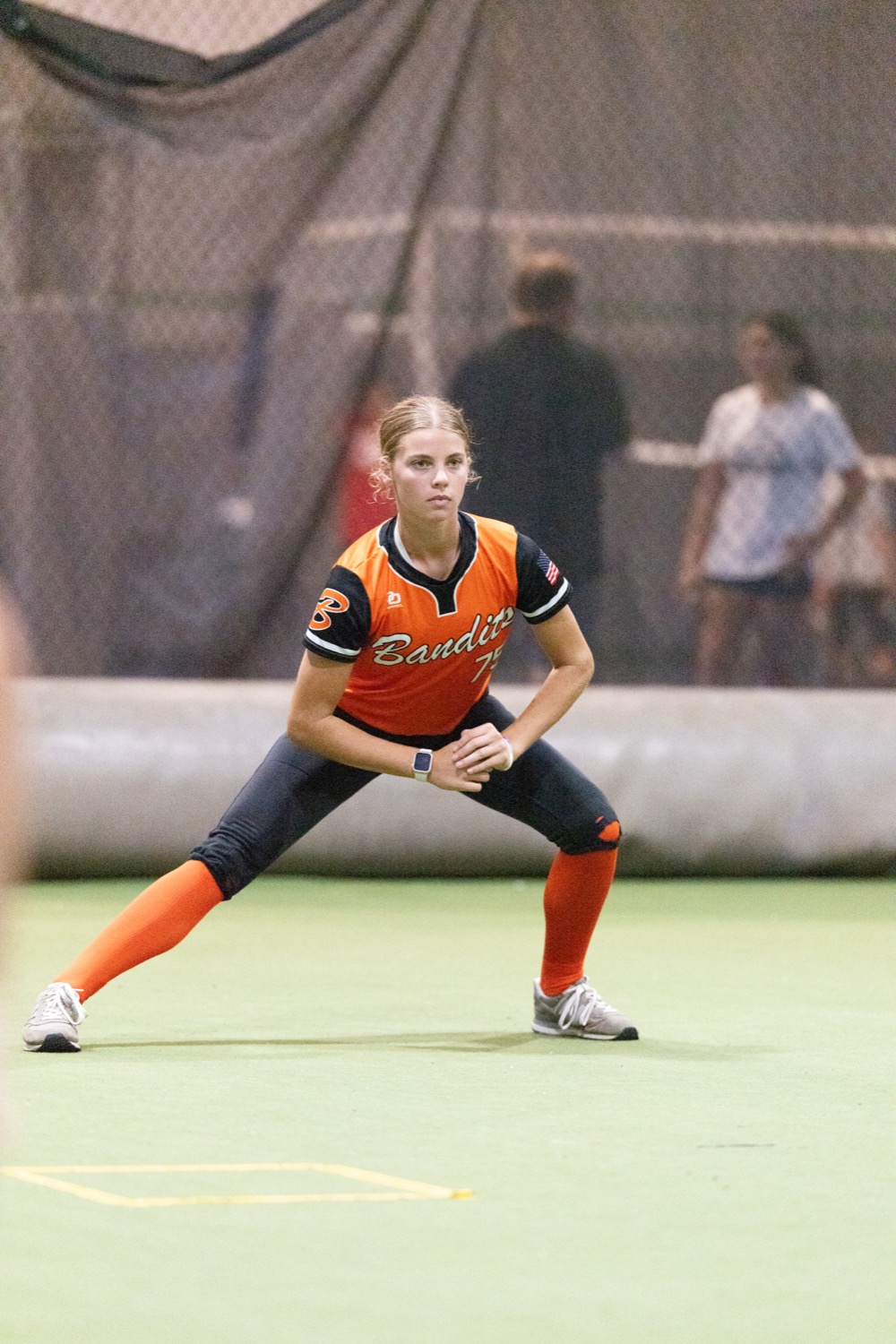 Athlete in an athletic ready position during warm-up