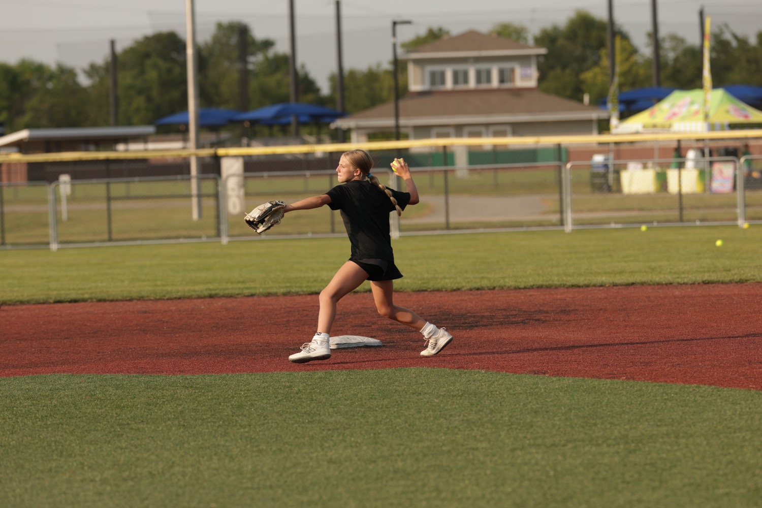Softball athlete throwing during a High Level Throwing session
