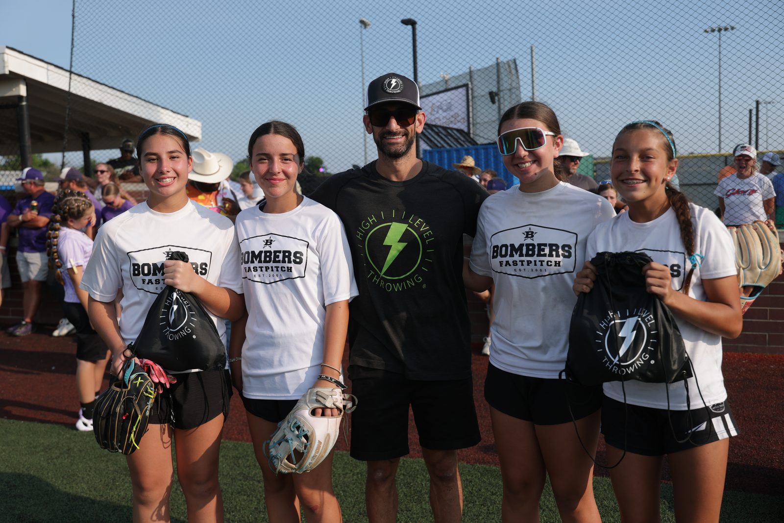 Austin Wasserman with softball athletes after a High Level Throwing session