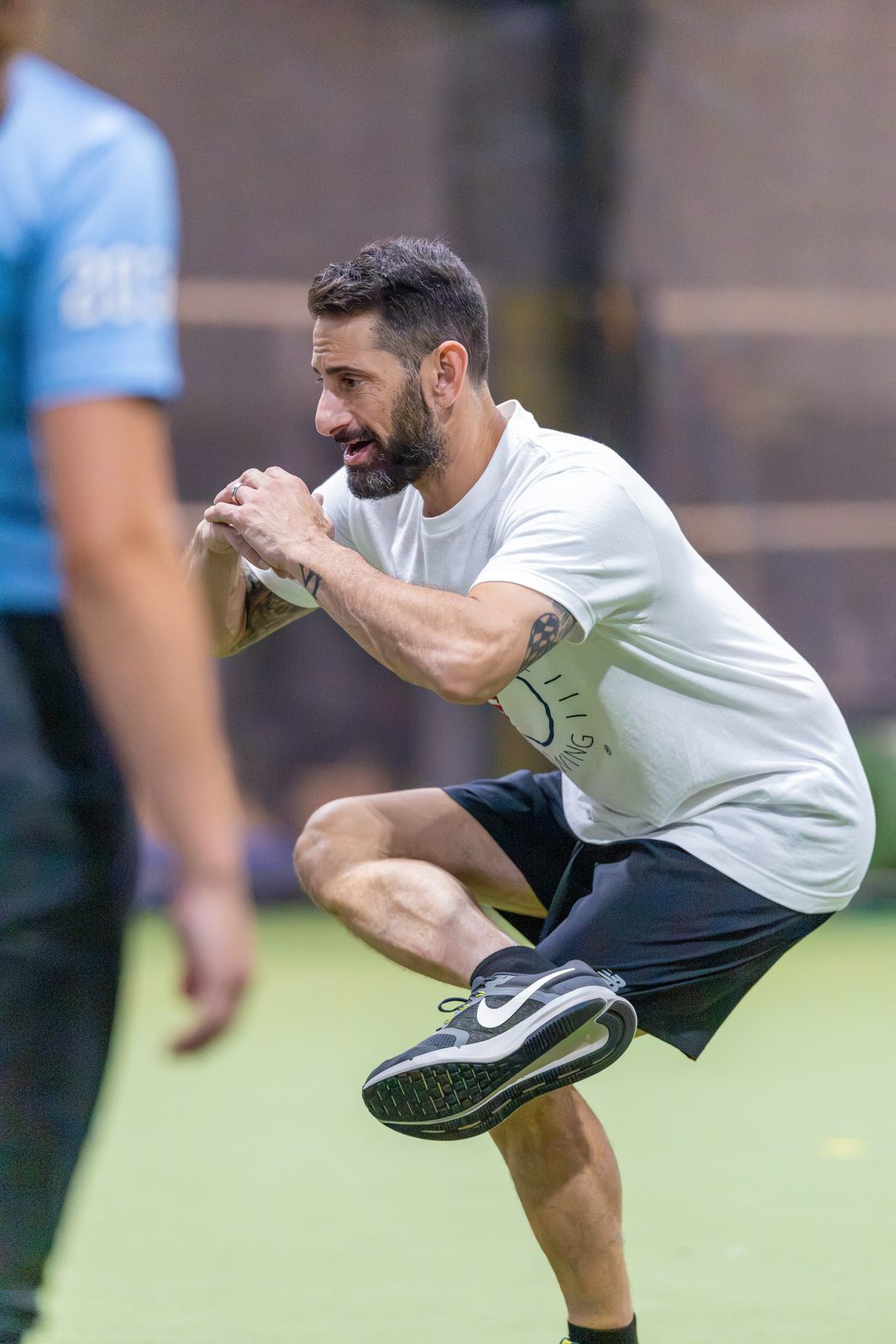 Austin Wasserman demonstrating a figure-four position to show how the lower body drives the throw